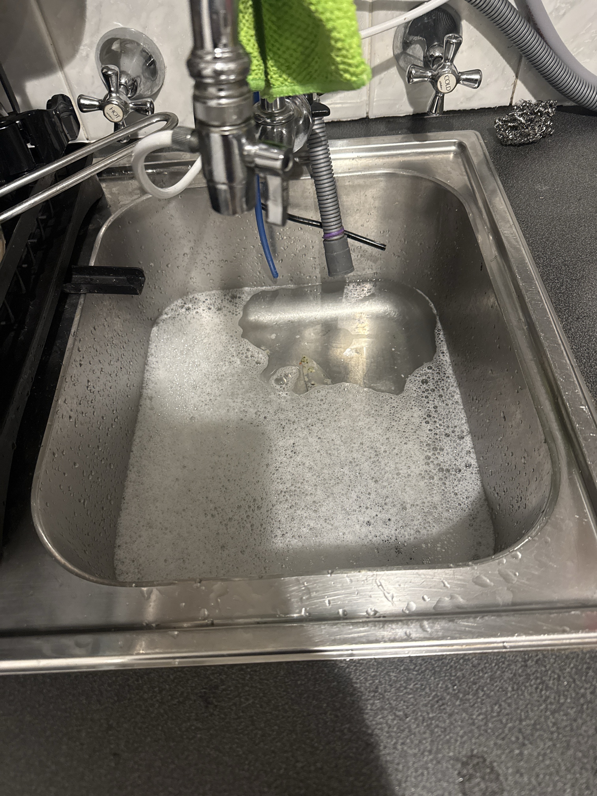 Blocked kitchen sink in Manly Vale, full of water after the pipe below it stopped draining