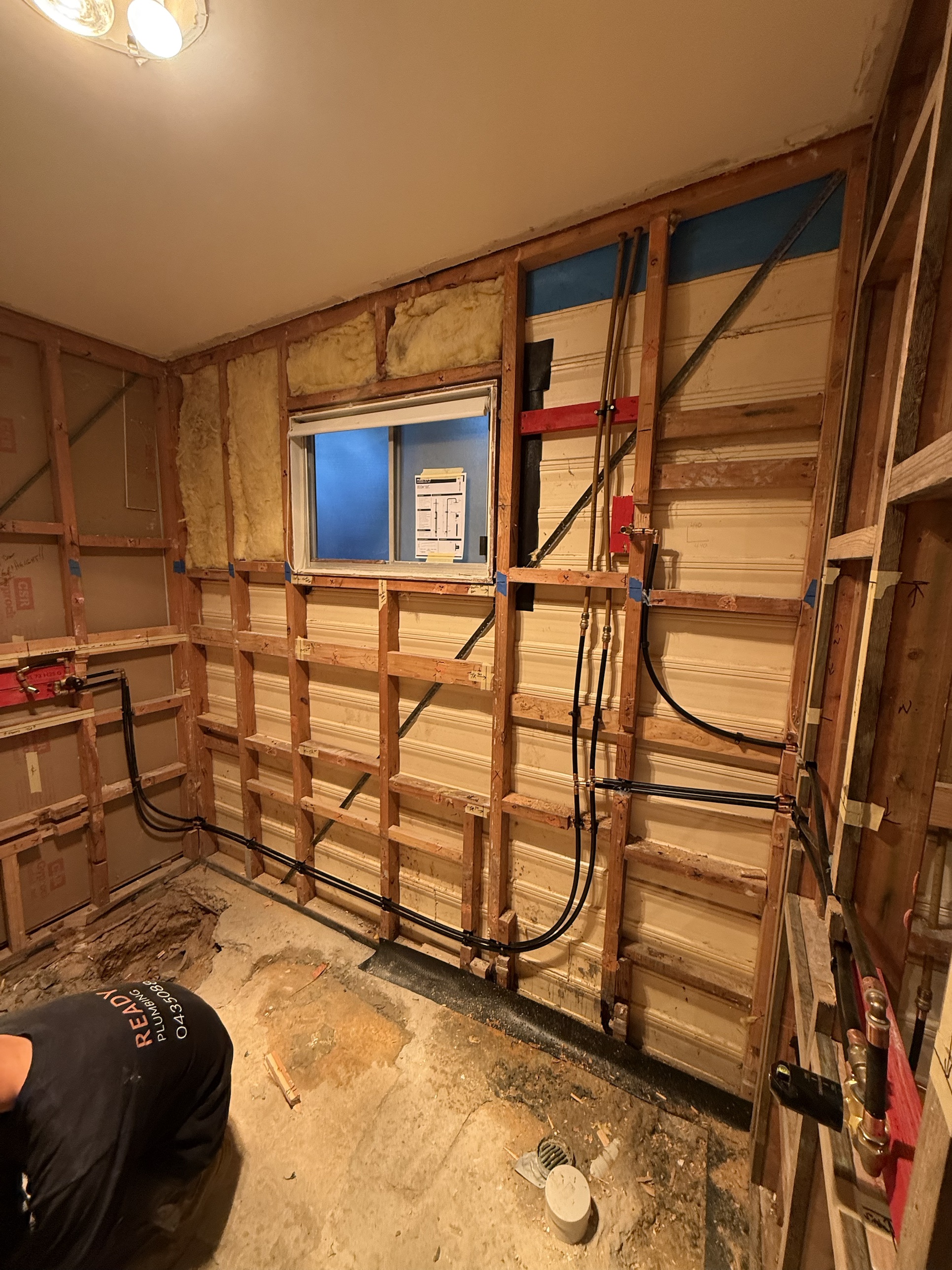New hot and cold water pipework run through wall framing by Ready Plumbing