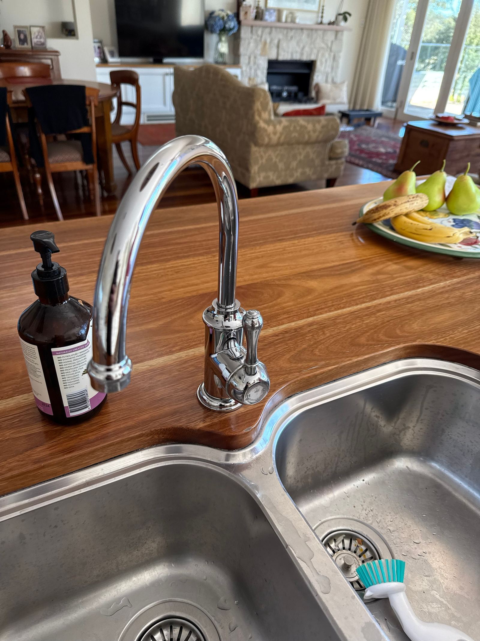 New chrome kitchen mixer tap replaced over a double sink in a Mosman home