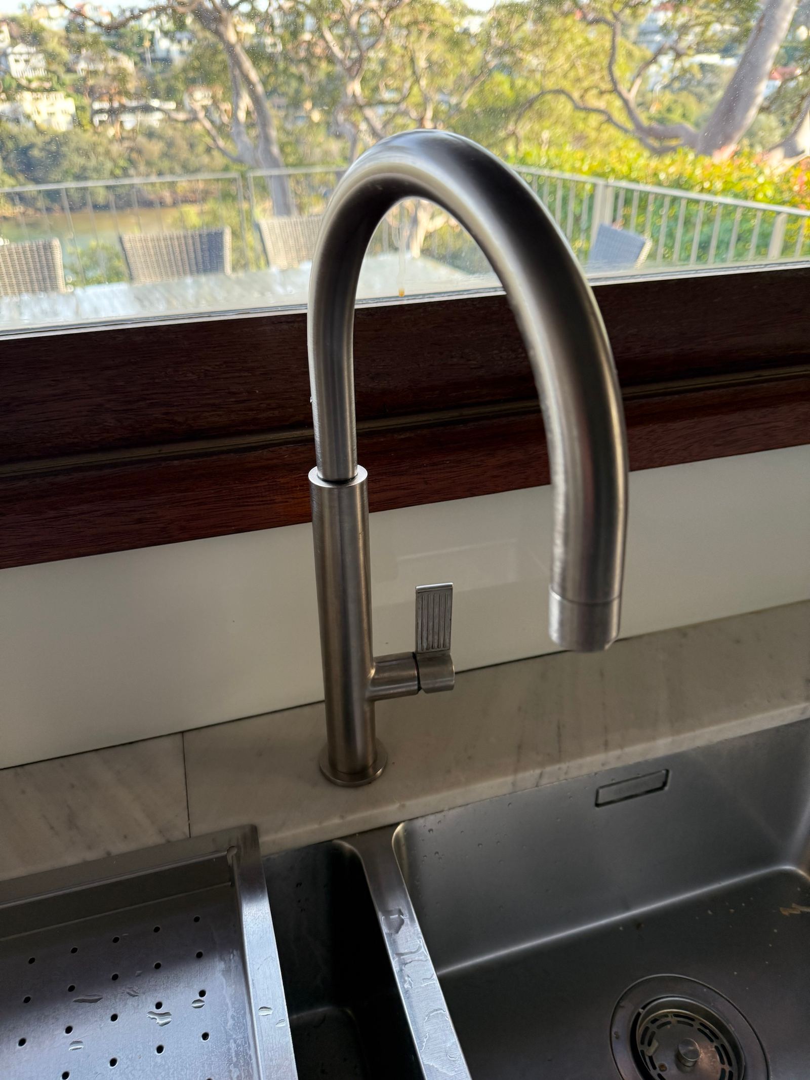 New brushed steel pull-down kitchen tap replaced in a Freshwater home