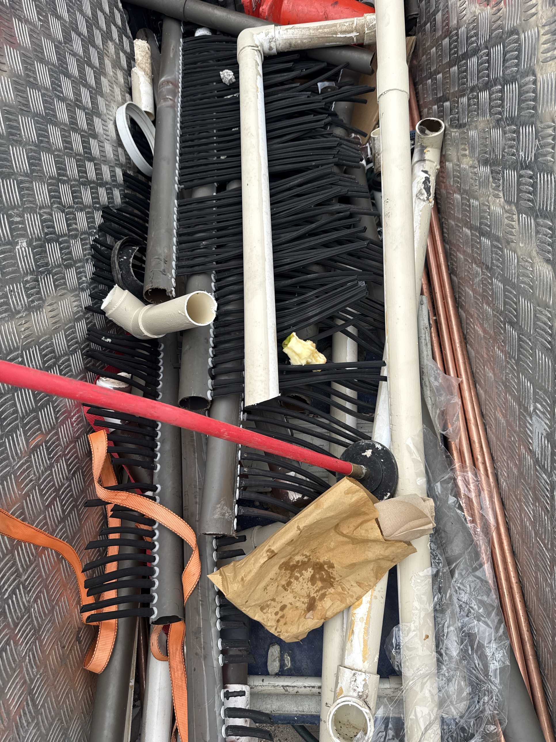 Old pool solar heating matting and pipework removed from the roof in Elanora Heights