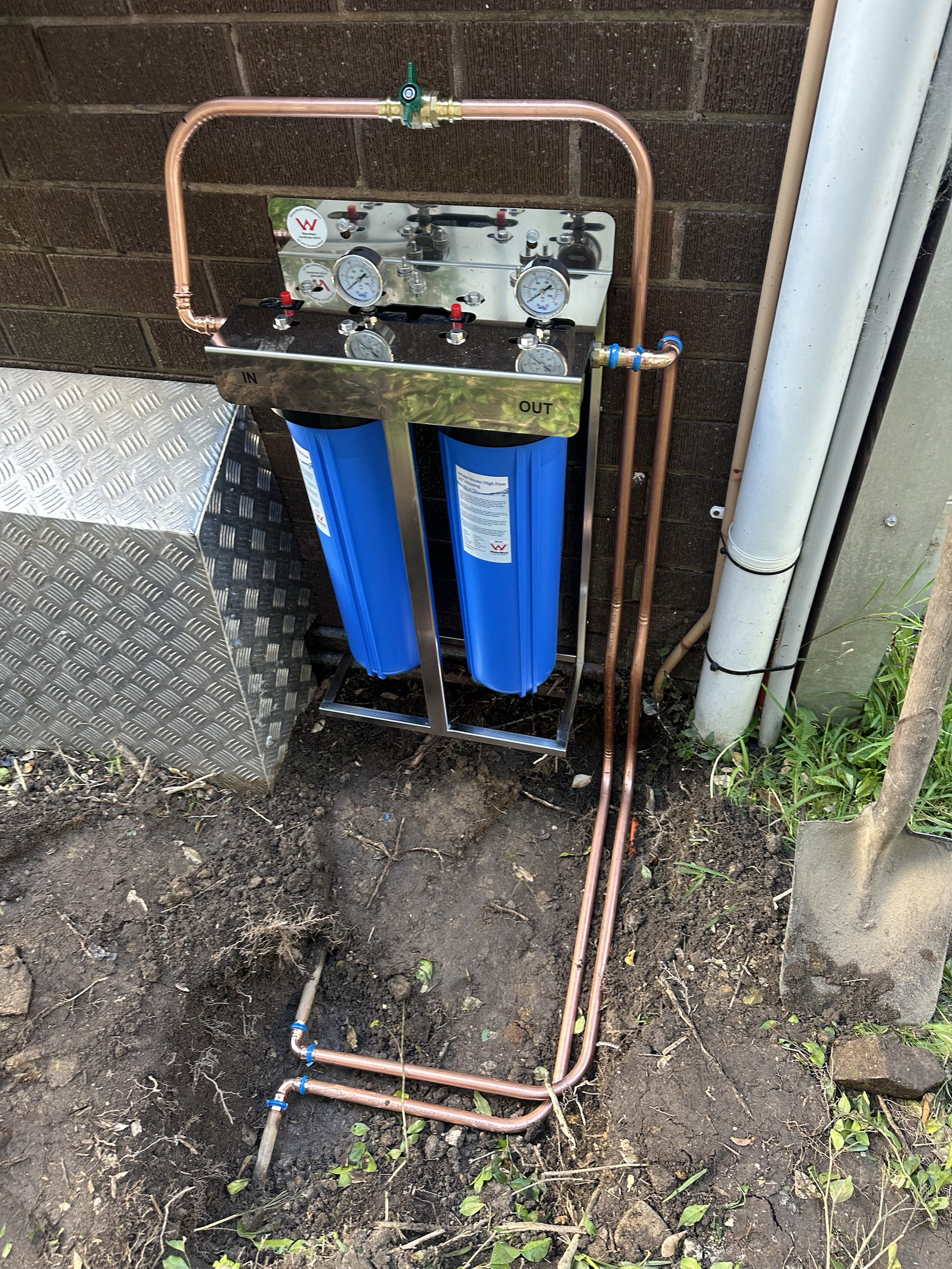 Whole house water filtration system with twin filter housings and pressure gauges, installed by Ready Plumbing